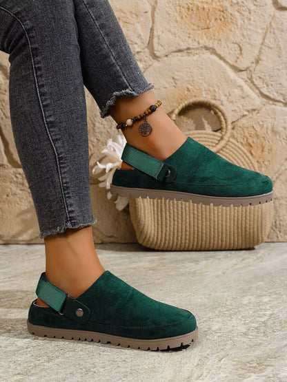 Green round-toe slip-on flats with side strap and textured tread sole