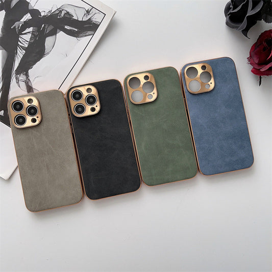 Four phone cases in different colors on a light surface with a magazine and flowers in the background.