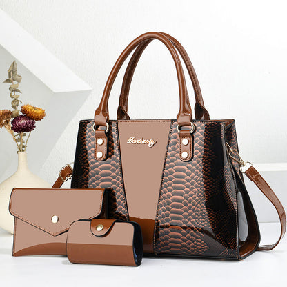 Black and tan large shoulder tote bag with top handles and matching wallet set