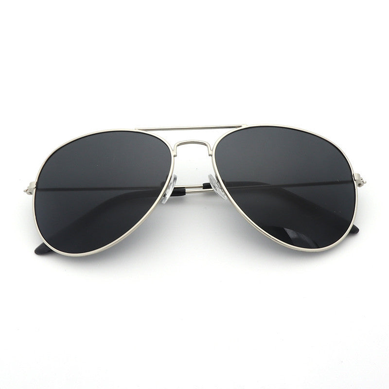 Aviator sunglasses with black lenses and silver frame on a white background