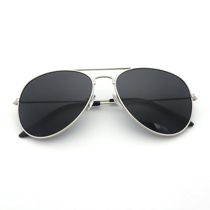 Aviator sunglasses with black lenses and silver frame on a white background