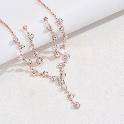 Rose-gold crystal necklace with matching earrings and bracelet