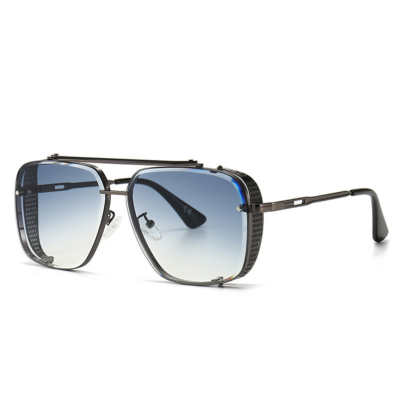 Sunglasses with a black frame and gradient lenses on a white background