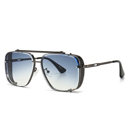 Sunglasses with a black frame and gradient lenses on a white background