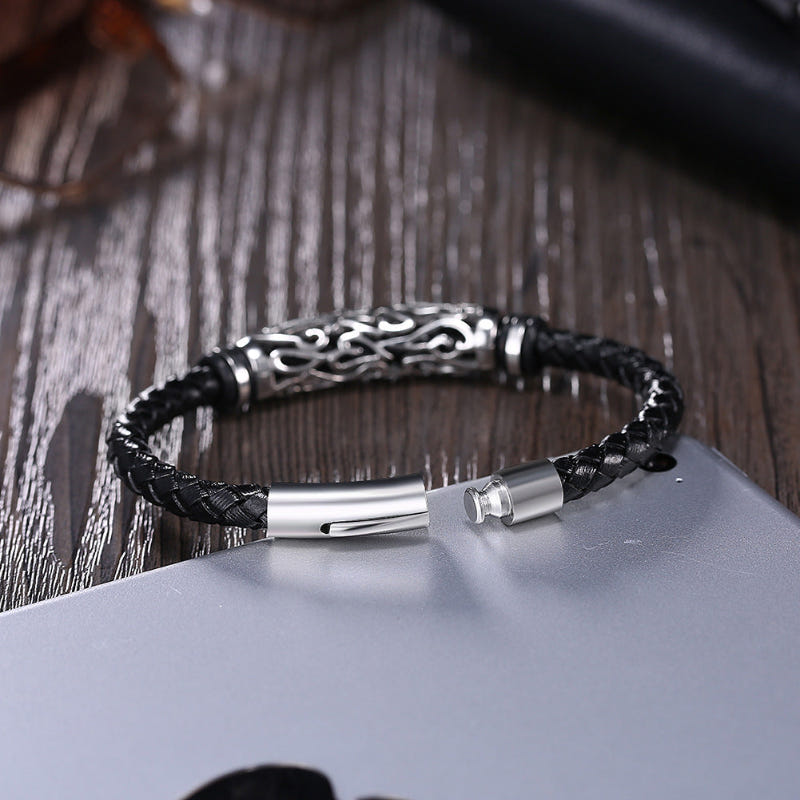 Black braided leather bracelet with silver clasp and decorative metal bar