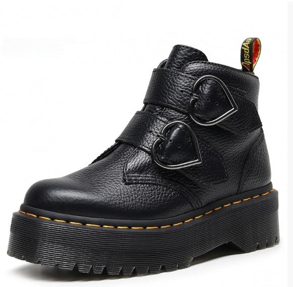 Black leather boot with heart-shaped buckles on a white background