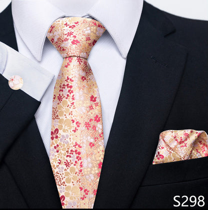 Floral tie and pocket square set with a black suit and white shirt