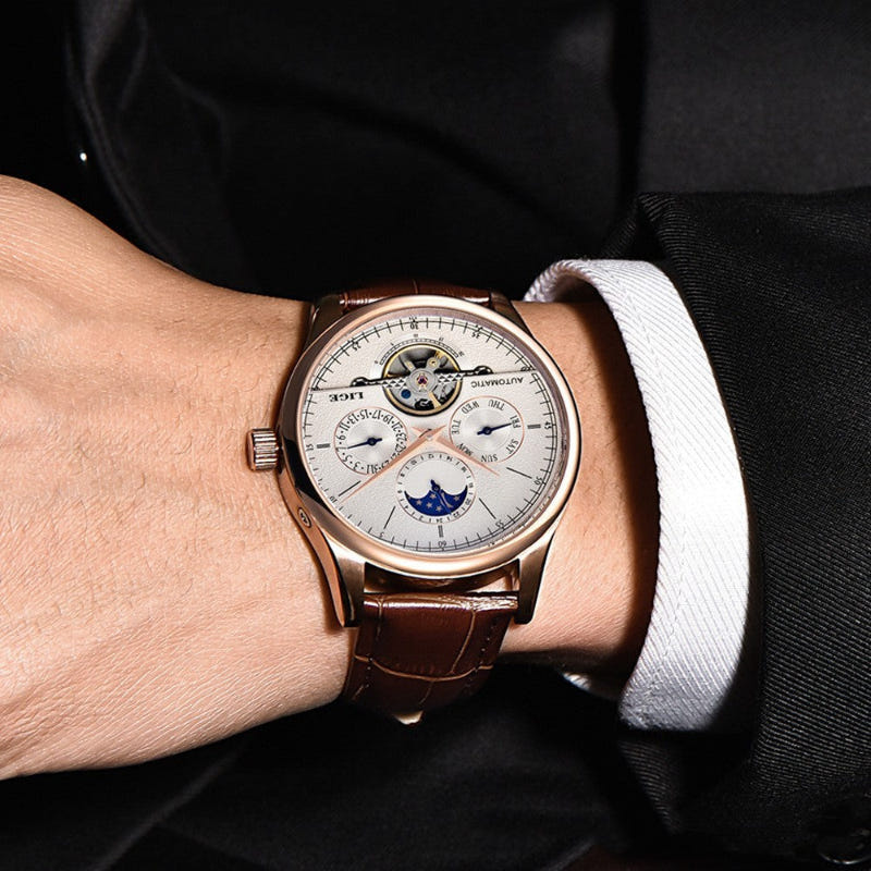 Men's automatic calendar watch on wrist, rose-gold case, brown leather strap