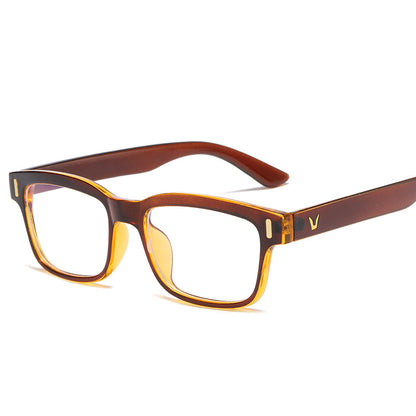 Brown and yellow eyeglasses on a white background