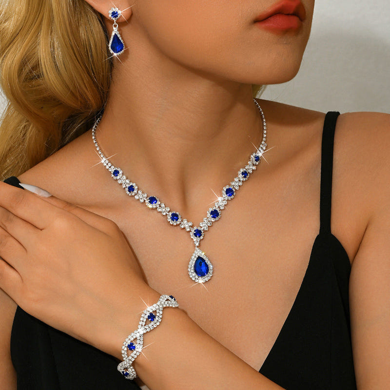 Bridal jewelry set with blue crystal drop necklace, teardrop pendant, and earrings