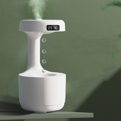 White humidifier with digital display on a green background
