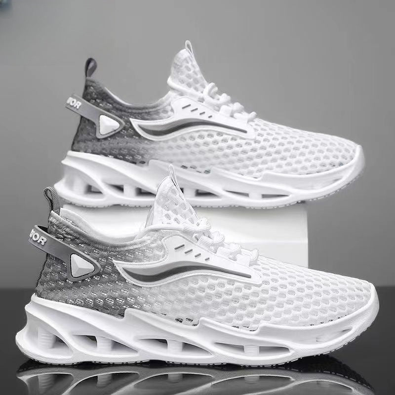 White and gray athletic shoes on a reflective surface with a gray background