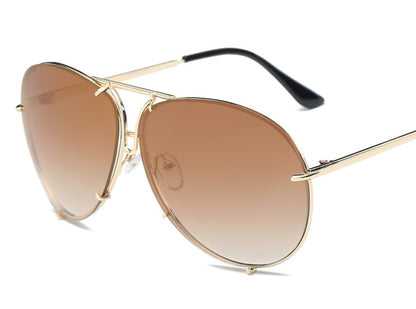 Aviator sunglasses with gold frame and brown gradient lenses on a white background