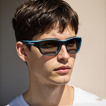Man wearing blue sunglasses with a neutral background