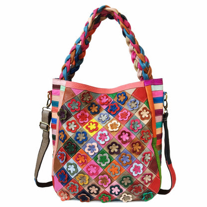 Colorful patchwork handbag with braided handle on a white background