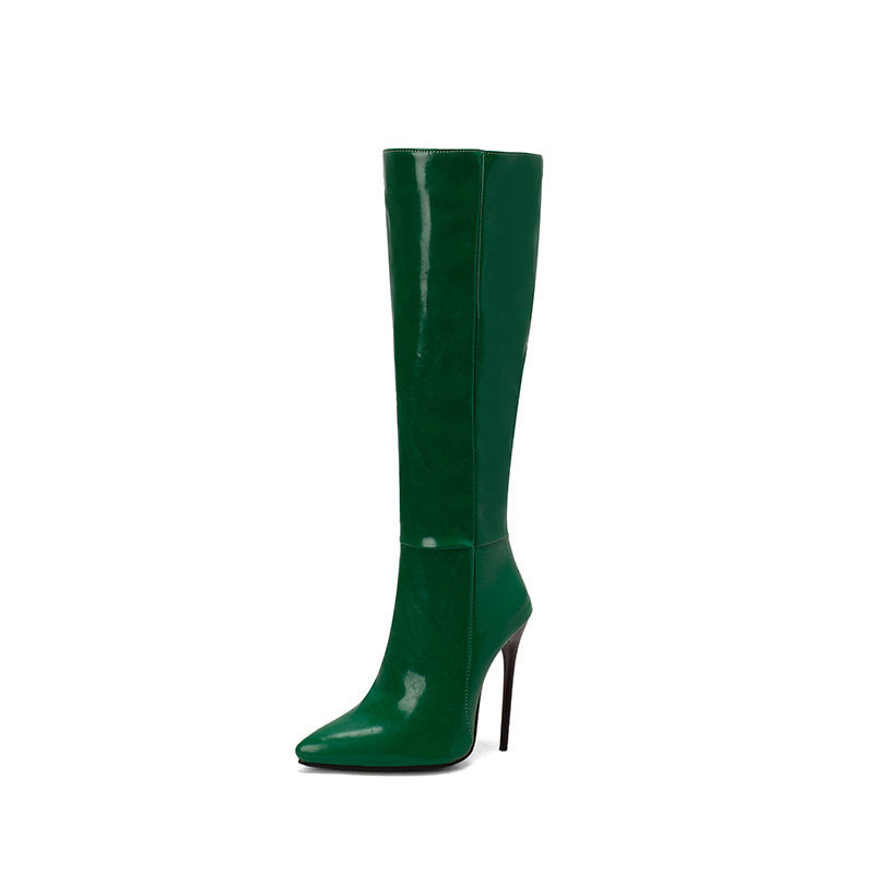 Green knee-high boot with a high heel on a white background