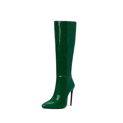 Green knee-high boot with a high heel on a white background
