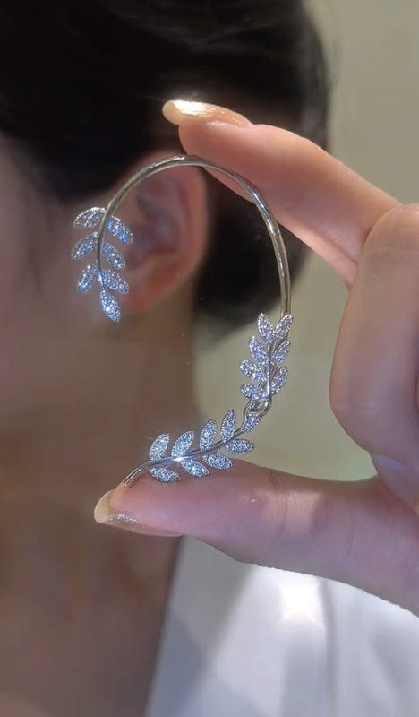 Silver hoop earrings with dangling butterfly zircon charms