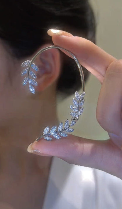 Silver hoop earrings with dangling butterfly zircon charms