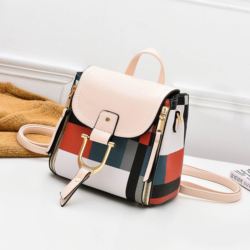 Cream and plaid crossbody bag with top flap buckle strap and side zipper