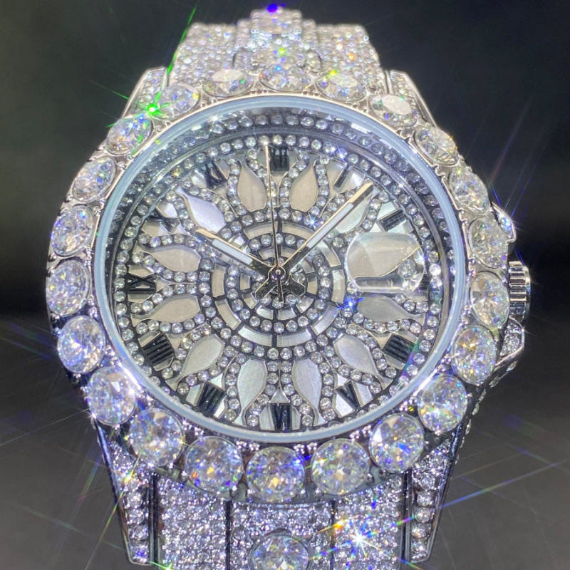 Diamond-encrusted watch with dark dial, crystal hour markers, and silver-toned bezel and strap.