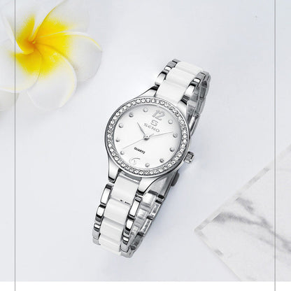 Silver ceramic quartz watch with white dial, rhinestone bezel, metal link bracelet