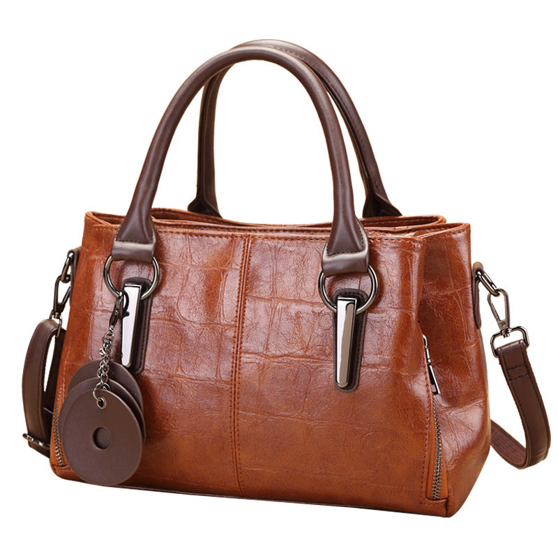 Brown retro classic large-capacity handbag with two handles, metal buckles, and side zipper
