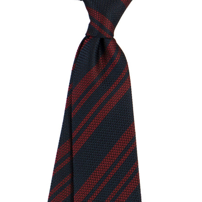 Navy and red striped tie on a white background