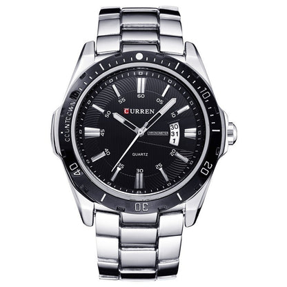 Curren watch with black dial and silver metal strap on a white background