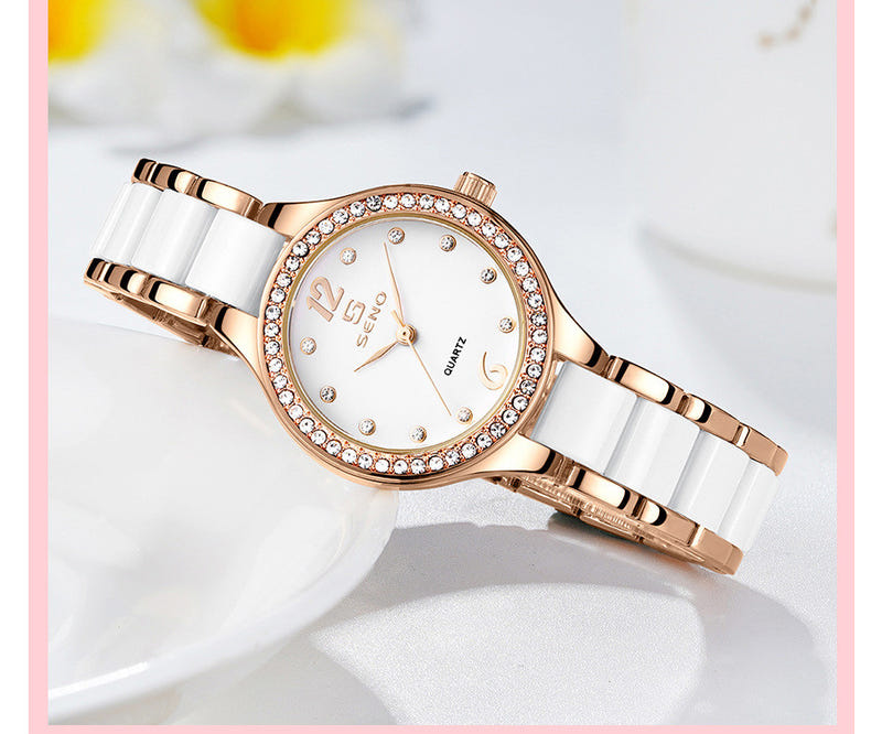 Rose-gold ceramic quartz watch with white dial, rhinestone bezel, link bracelet