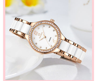 Rose-gold ceramic quartz watch with white dial, rhinestone bezel, link bracelet