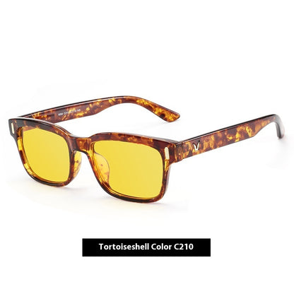 Sunglasses with tortoiseshell frame and yellow lenses on a white background