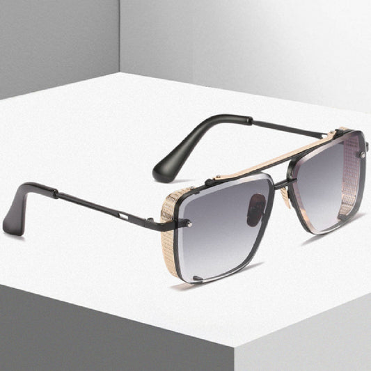 Sunglasses with black frame and gradient lenses on a white platform