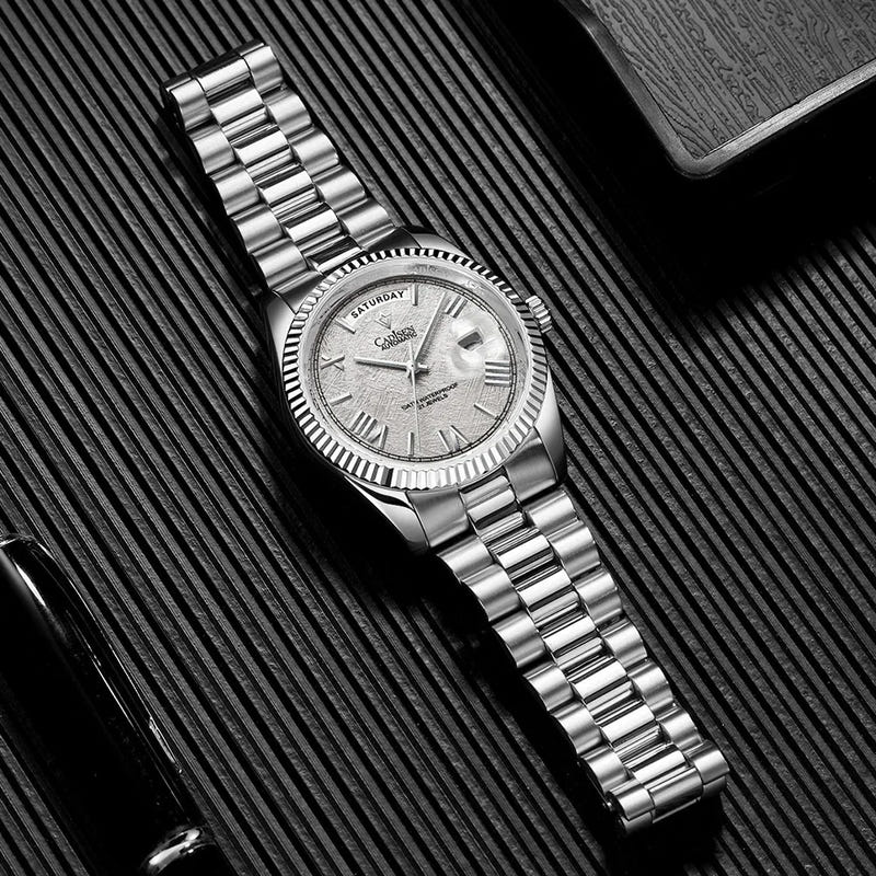 Men’s automatic mechanical watch with silver dial and ridged bezel on metal link bracelet