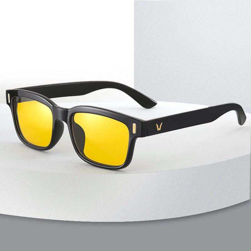 Sunglasses with yellow lenses and black frames on a white background