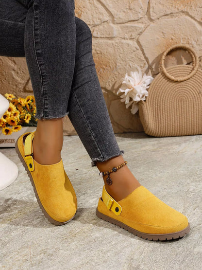 Yellow round-toe slip-on flats with side button strap detail