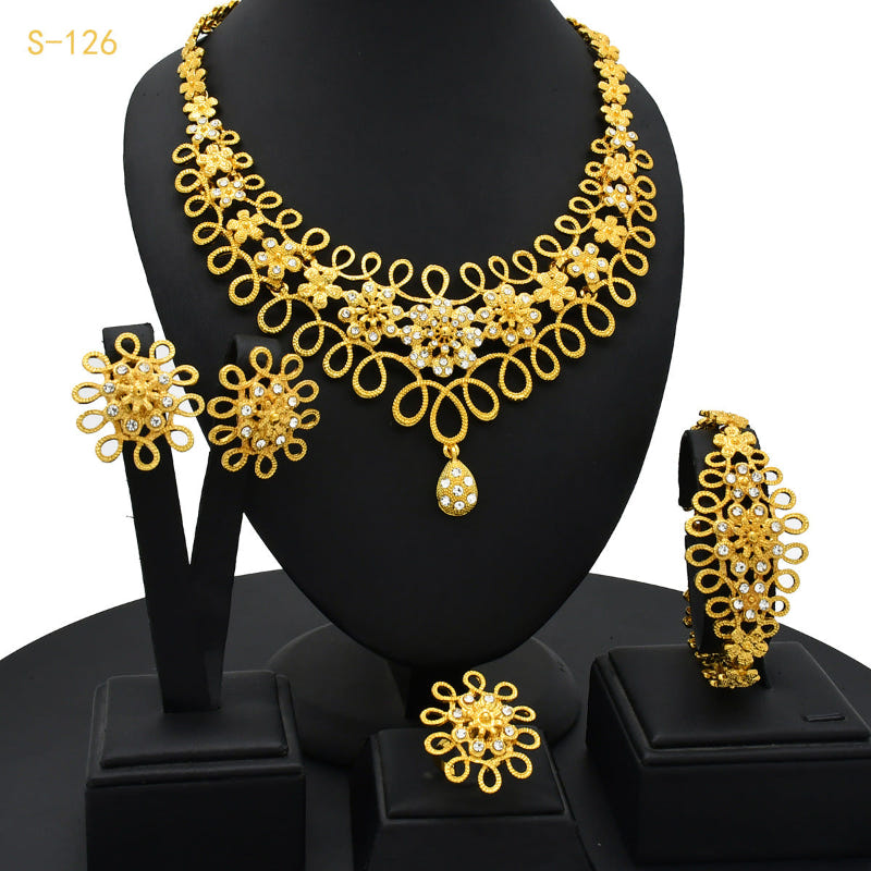 Gold-tone filigree rhinestone jewelry set: necklace, earrings, bracelet, ring