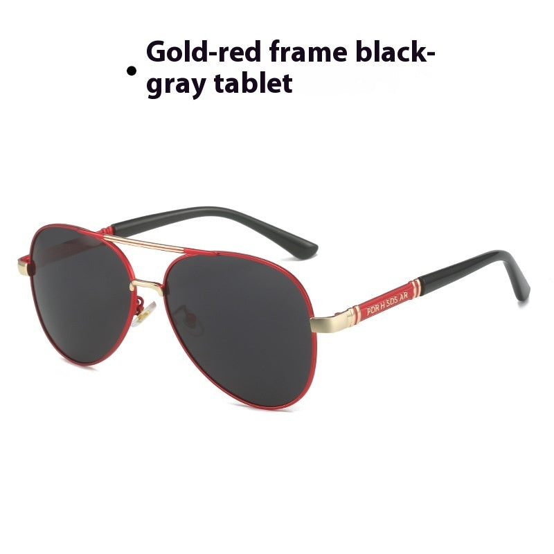 Sunglasses with gold-red frame and black-gray lenses on a white background