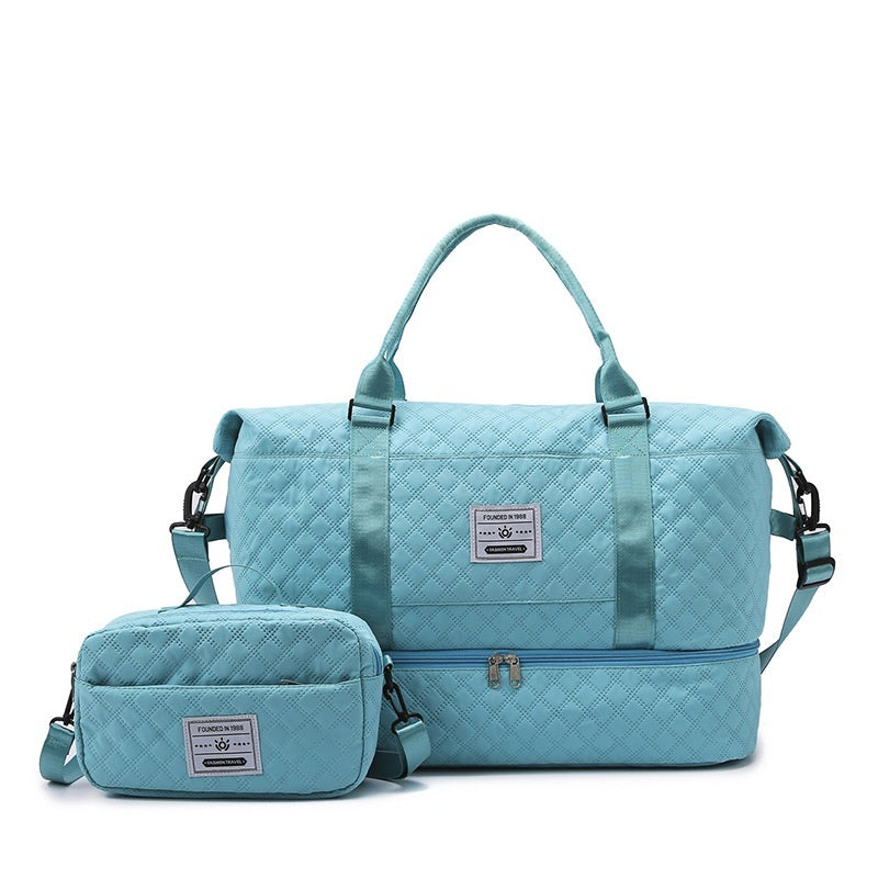 Light blue quilted travel bag with front zip and matching crossbody pouch