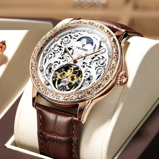 Luxury watch with brown leather strap and visible brand name on a light background