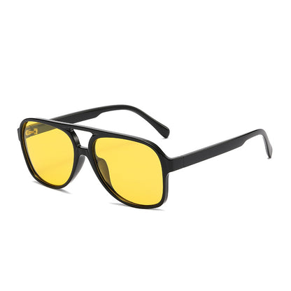 Black sunglasses with yellow lenses on a white background