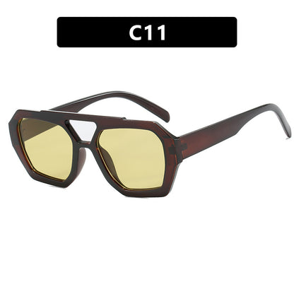 Sunglasses with a brown frame and yellow lenses on a white background