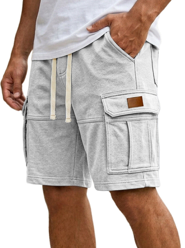 Gray shorts with pockets and a drawstring on a white background