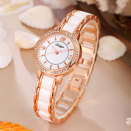 Rose gold round quartz wristwatch with white dial and white link bracelet
