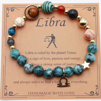 Zodiac bracelet with teal and white stone beads, gold-tone spacers, and star charm