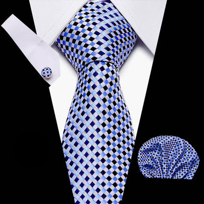 Blue and black checkered tie with matching pocket square and cufflinks on a white background.