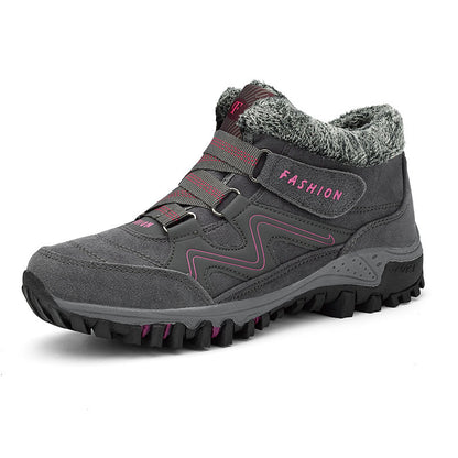 Mid-cut casual sports shoes with thick sole, dark gray upper with fuzzy collar and pink lacing.
