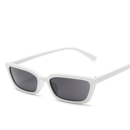 White sunglasses with dark lenses on a white background
