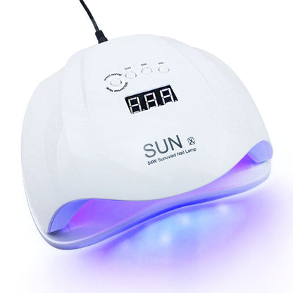 White nail lamp with purple light on a white background