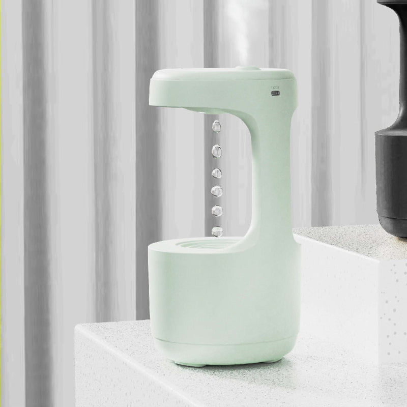 Mint green anti-gravity humidifier with clock display and side control buttons